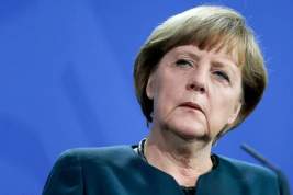 Меркель провела параллель между присоединением Крыма к России и расколом Германии